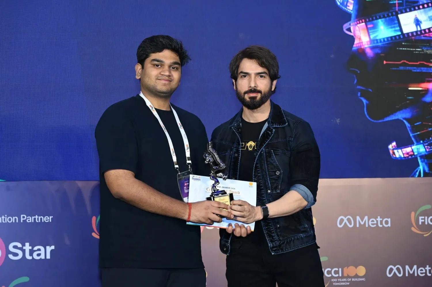 Arnav Anand holds the Best Cover trophy and certificate at the FICCI BAF Awards 2026.