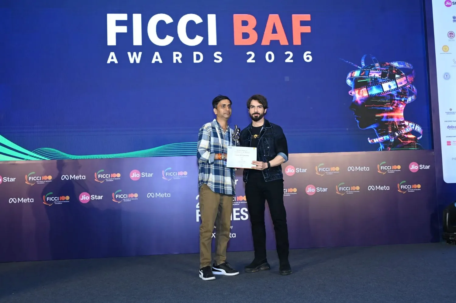 Anadi Abhilash holds the certificate and trophy on stage under the FICCI BAF Awards 2026 backdrop.