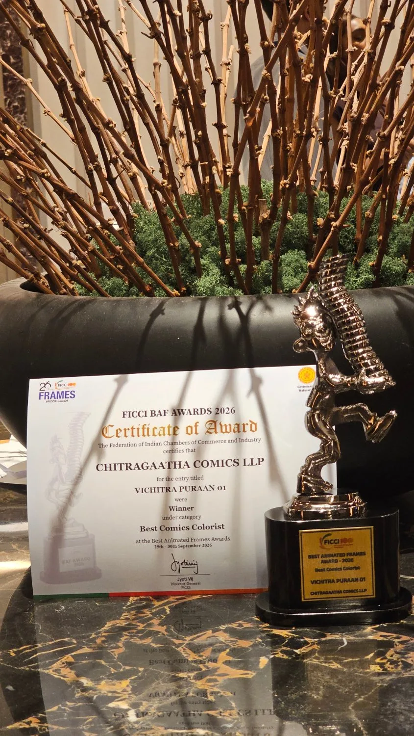 A FICCI BAF Awards 2026 certificate naming Chitragaatha Comics for Vichitra Puraan 01 as Best Comics Colourist, standing beside the trophy.