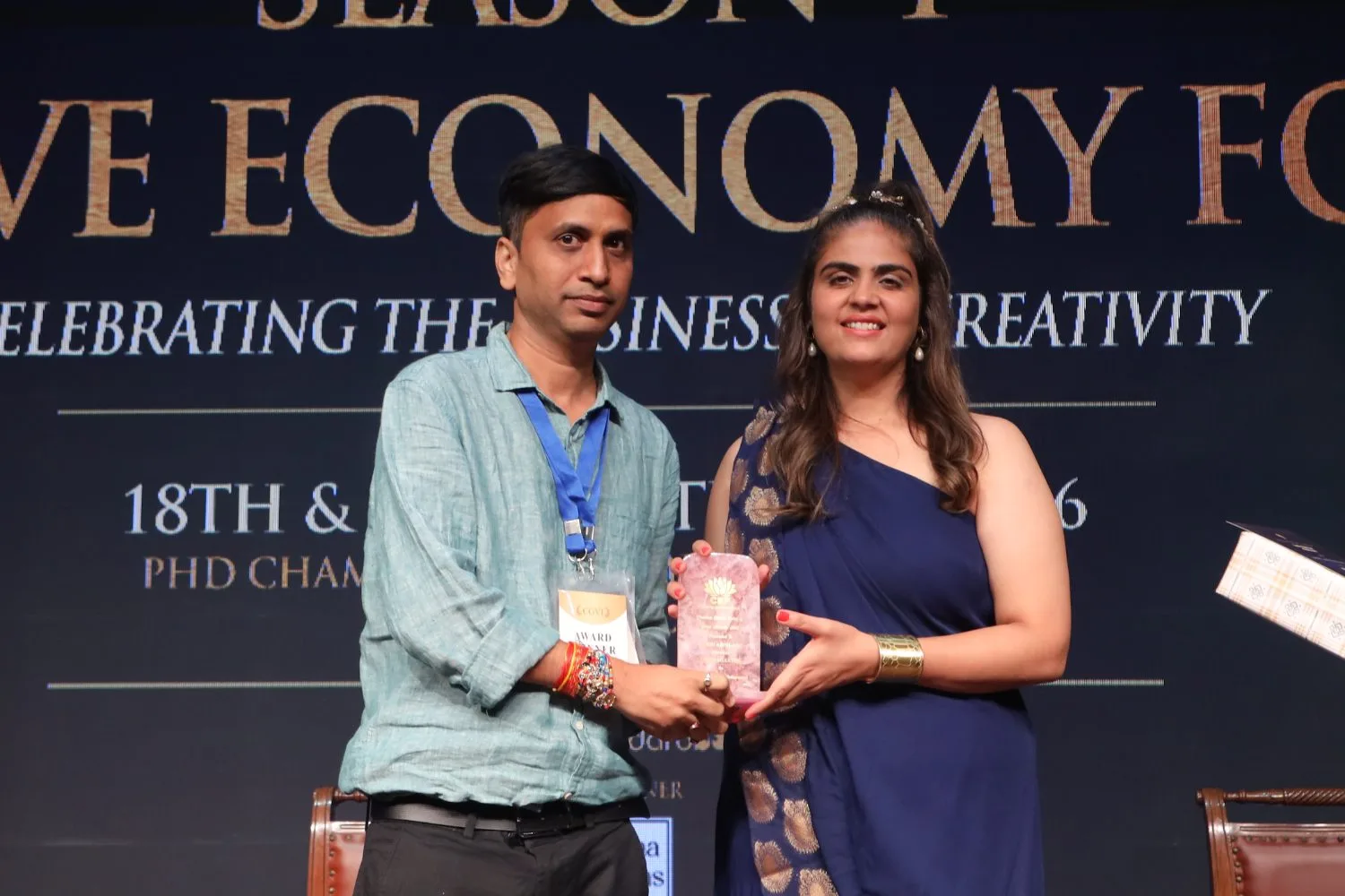 Anadi Abhilash receives an award on stage at Creative Economy Forum Season 4
