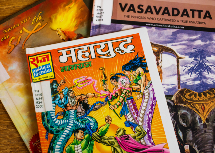 Librarian Mara Thacker with the Indian comics collection